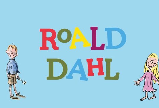 Colorful illustration of children interacting with books and toys, with the text "Roald Dahl" in the center. The background is light blue. Artwork by Quentin Blake.